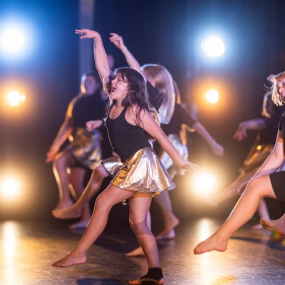 Young boy pulling archery bow